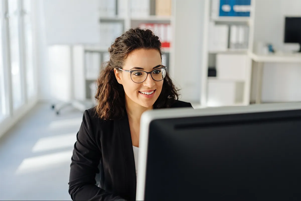 Medical coder working at desk